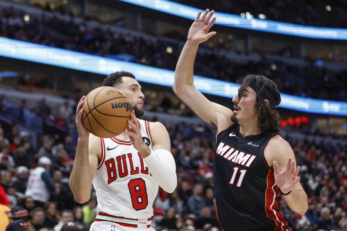 Chicago Bulls guard Zach LaVine (8) looks to pass the ball against Miami Heat guard Jaime Jaquez Jr. (11) during the first half at United Center.