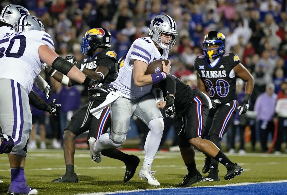 Nov 18, 2023; Lawrence, Kansas, USA; Kansas State Wildcats quarterback Will Howard (18) runs the ball for a two point conversion against the Kansas Jayhawks during the second half at David Booth Kansas Memorial Stadium. M