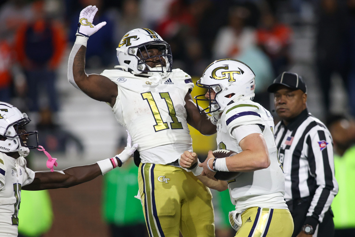 Nov 18, 2023; Atlanta, Georgia, USA; Georgia Tech Yellow Jackets quarterback Haynes King (10) celebrates after a touchdown with running back Jamal Haynes (11) against the Syracuse Orange in the second half at Bobby Dodd Stadium at Hyundai Field. (Brett Davis / USA TODAY Sports).