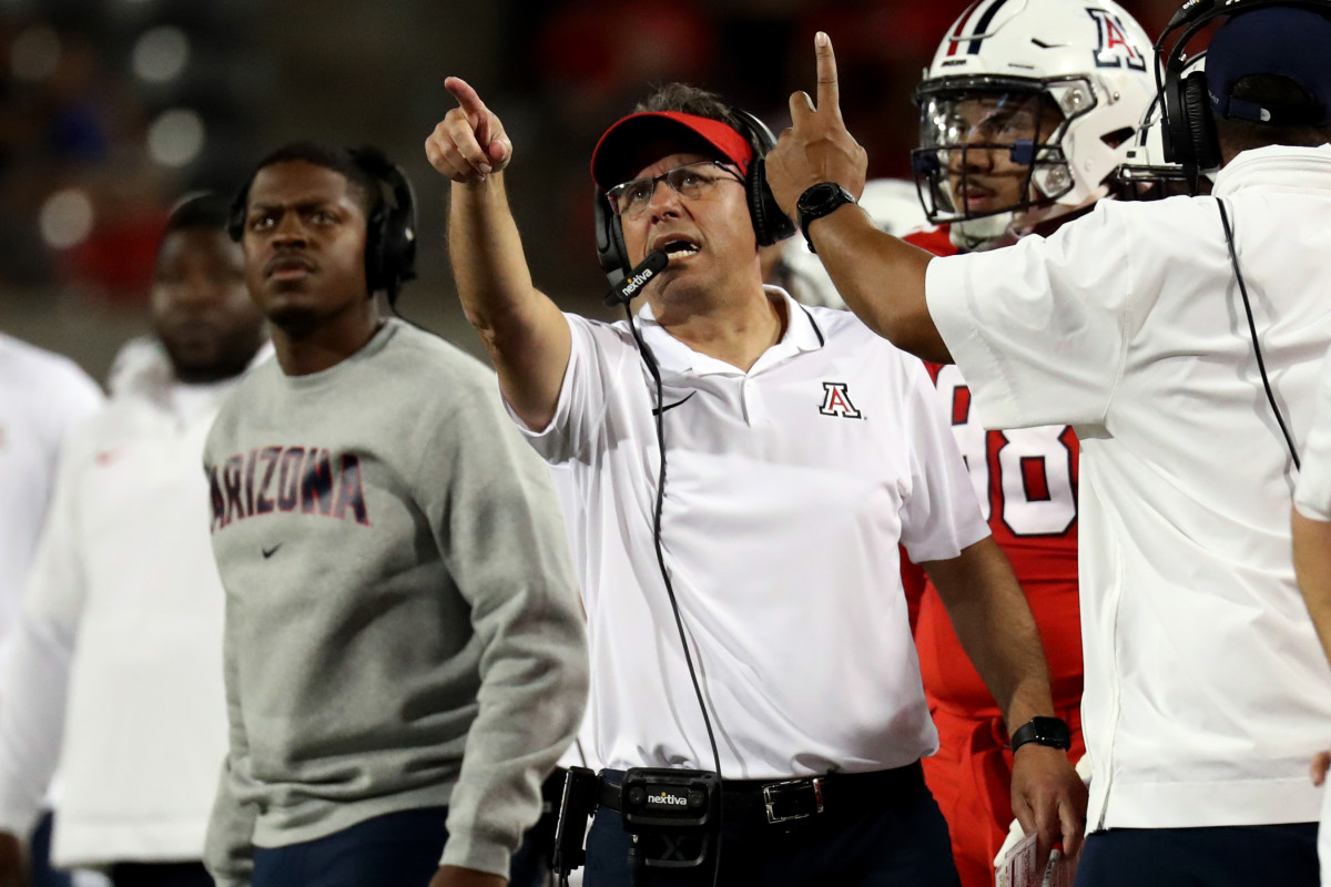 Sep 30, 2023; Tucson, Arizona, USA; Arizona Wildcats head coach Jedd Fisch points at the score board after a fumble call in the first half at Arizona Stadium.