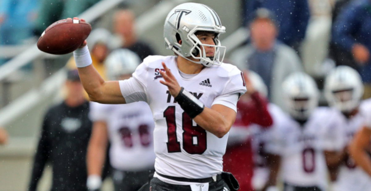 Troy Trojans quarterback Gunnar Watson attempts a pass during a college football game in the Sun Belt.