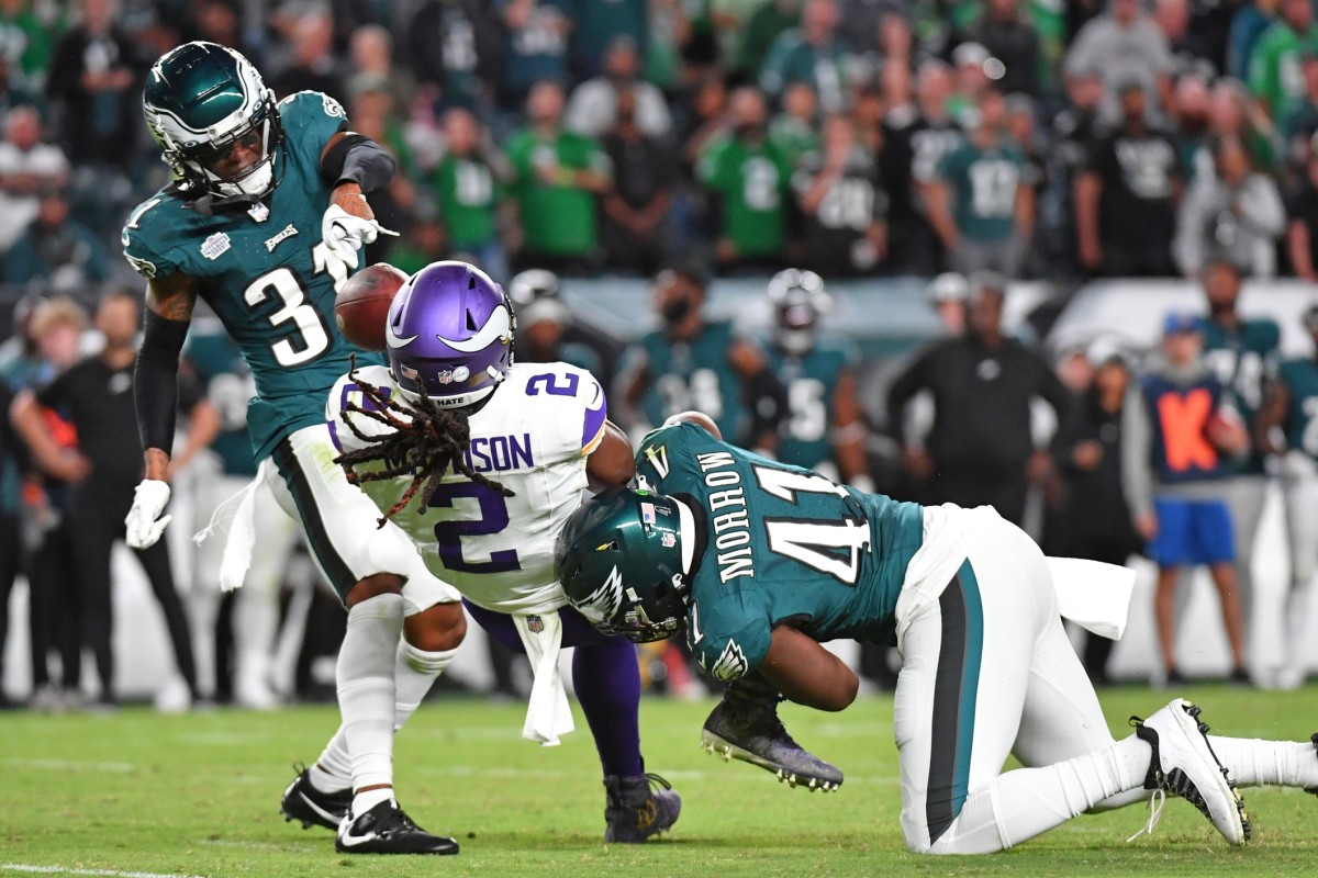 Sep 14, 2023; Philadelphia, Pennsylvania, USA; Minnesota Vikings running back Alexander Mattison (2) fumbles the ball after being hit by Philadelphia Eagles linebacker Nicholas Morrow (41) and cornerback Mario Goodrich (31) at Lincoln Financial Field.