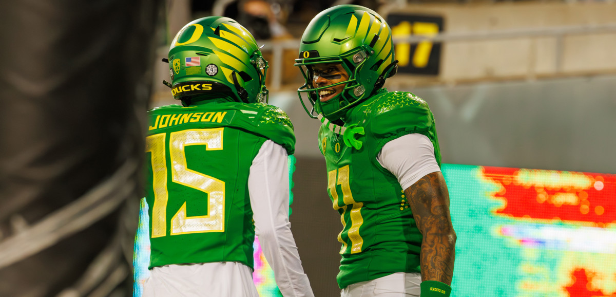 Oregon Ducks wide receiver Tez Johnson (15) celebrates a touchdown with wide receiver Troy Franklin (11).