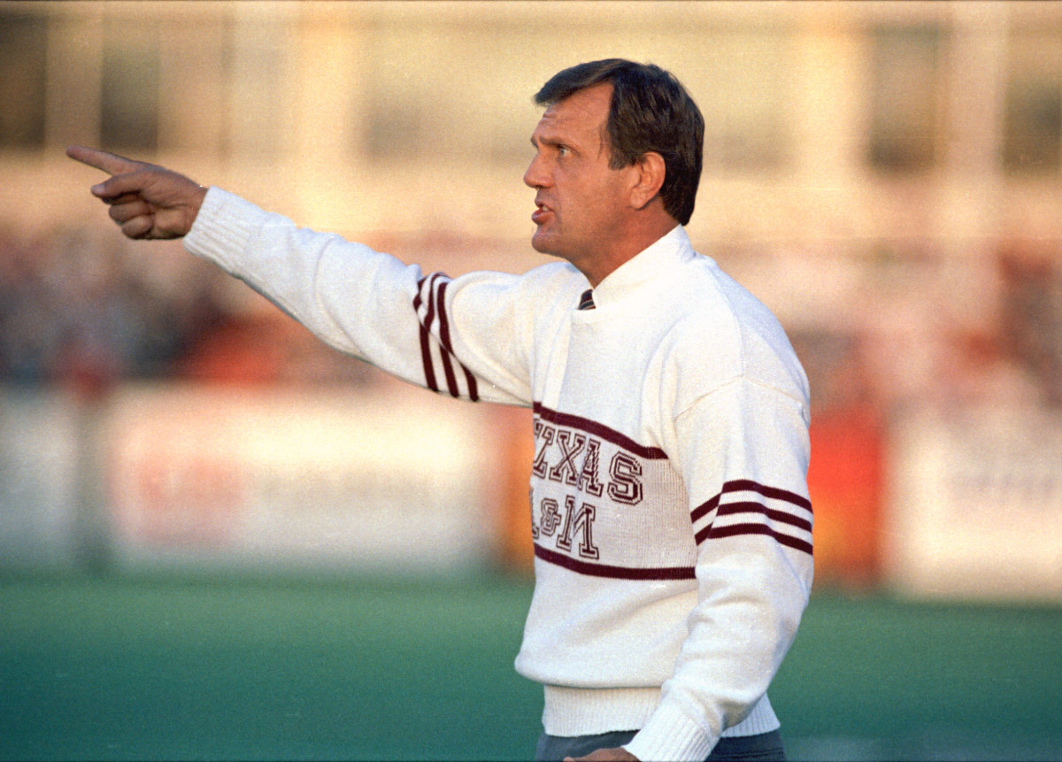 Texas A&M Aggies coach Jackie Sherrill points a finger toward his team from the field during practice.