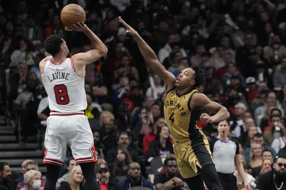 Toronto Raptors forward Scottie Barnes (4) defends against a shot by Chicago Bulls guard Zach LaVine (8) during the first half at Scotiabank Arena.
