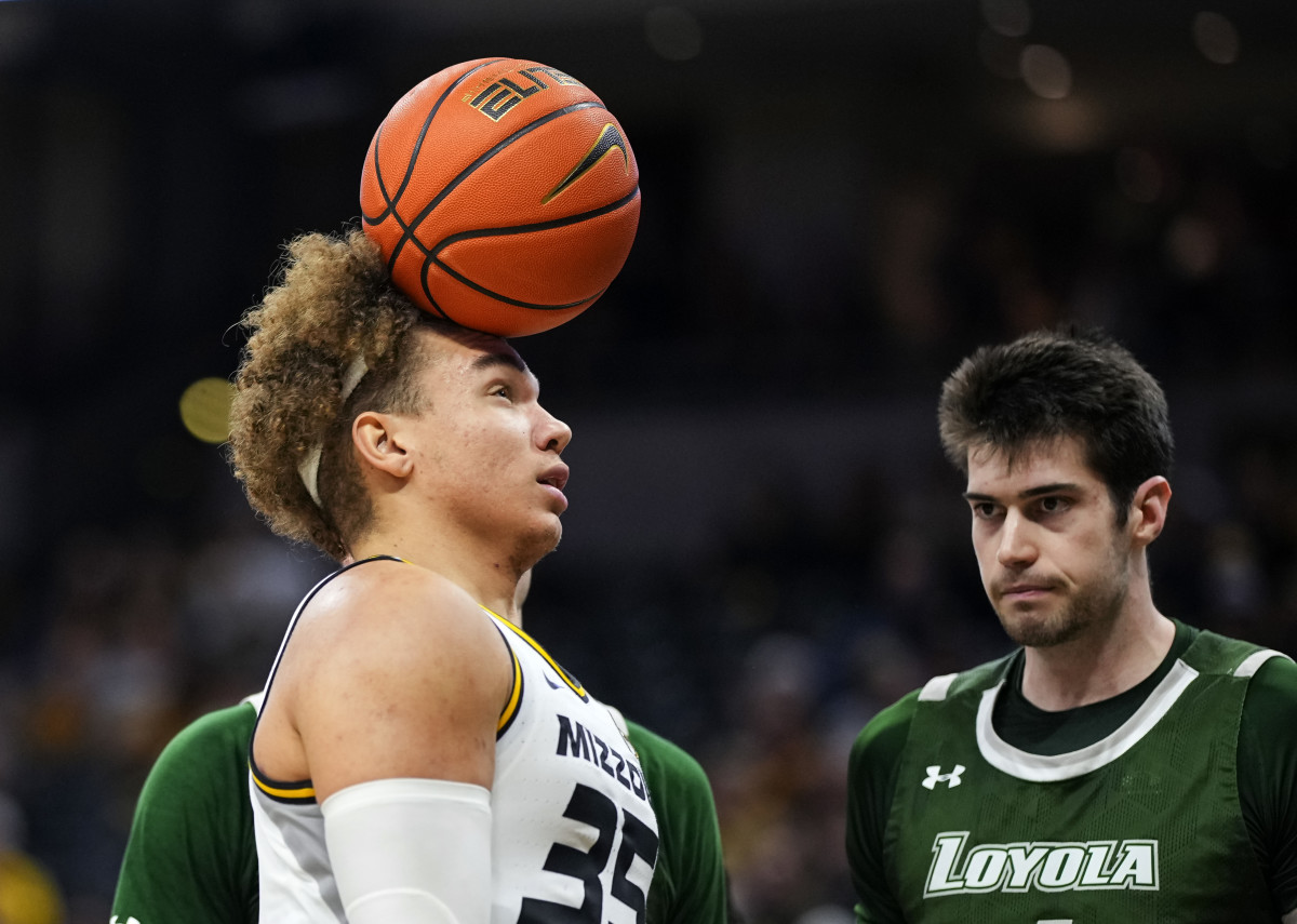 Missouri Tigers forward Noah Carter (35) heads the ball after scoring while fouled by Loyola (Md) Greyhounds forward Alonso Faure (4) during the second half at Mizzou Arena.