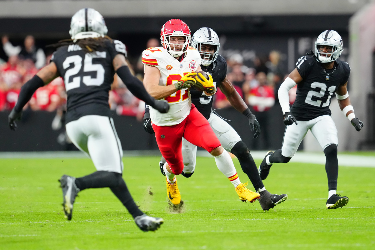 Kansas City Chiefs tight end Travis Kelce runs with the ball after making a catch against the Las Vegas Raiders during the second quarter at Allegiant Stadium.