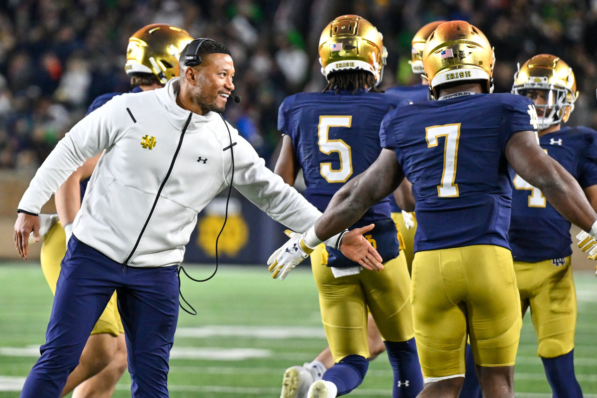 Nov 18, 2023; South Bend, Indiana, USA; Notre Dame Fighting Irish head coach Marcus Freeman celebrates with running back Audric Estime (7) after Estime scored in the third quarter against the Wake Forest Demon Deacons at Notre Dame Stadium. Mandatory Credit: Matt Cashore-USA TODAY Sports