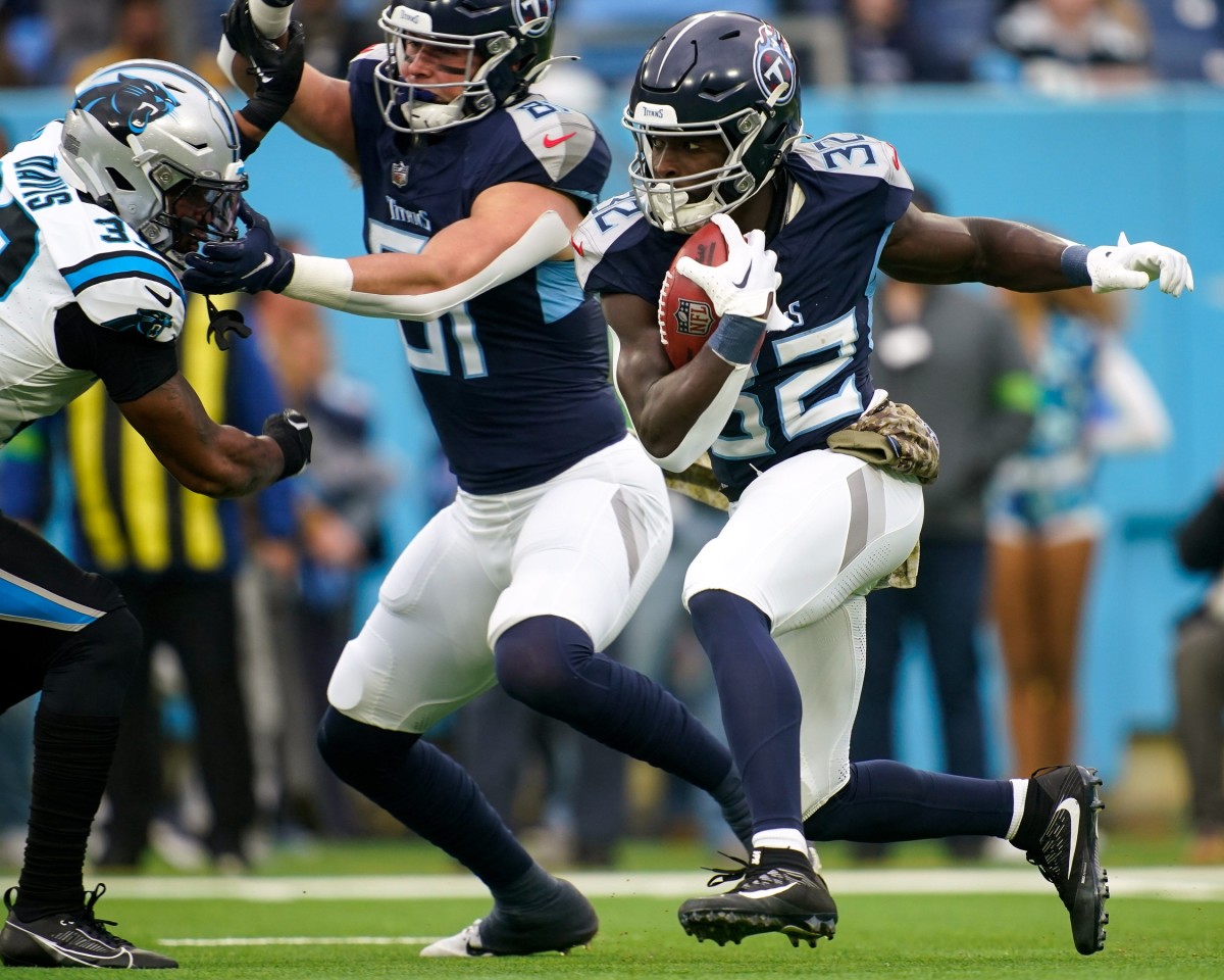 Tennessee Titans running back Tyjae Spears (32) runs the ball against the Carolina Panthers during the first quarter at Nissan Stadium.