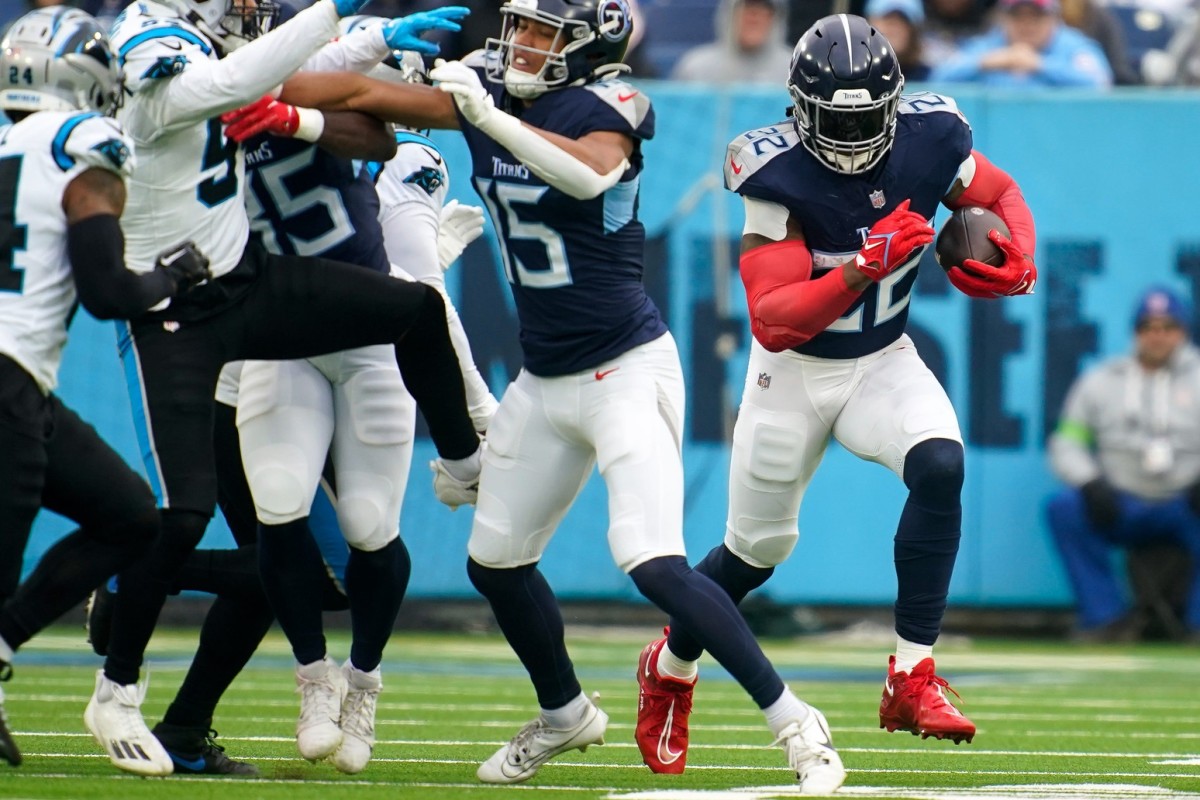 Tennessee Titans running back Derrick Henry (22) carries the ball to bring in a first down against the Carolina Panthers during the first quarter at Nissan Stadium.