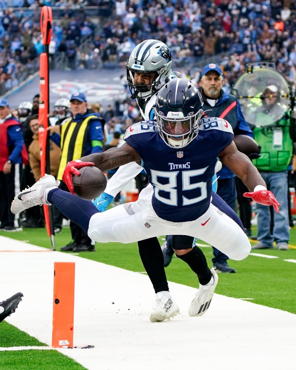 Tennessee Titans tight end Chigoziem Okonkwo (85) is pushed out of bounds at the one yard line by Carolina Panthers linebacker Kamu Grugier-Hill (54) during the first quarter at Nissan Stadium.