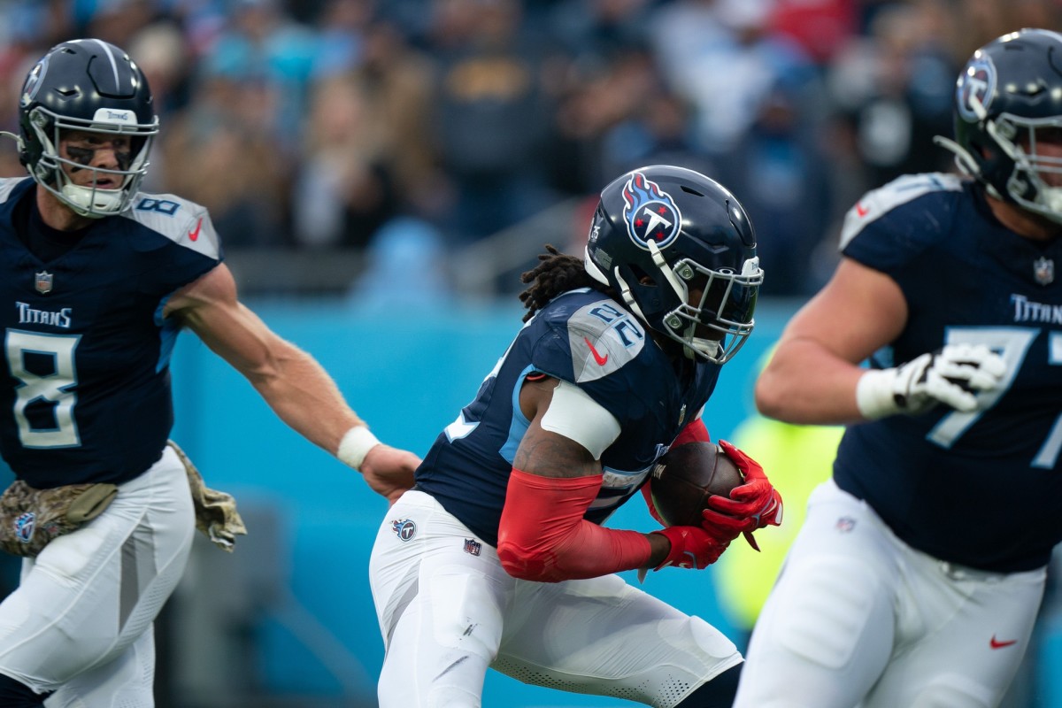 Tennessee Titans quarterback Will Levis (8) hands off to running back Derrick Henry (22) for a touchdown run against the Carolina Panthers during their game at Nissan Stadium.