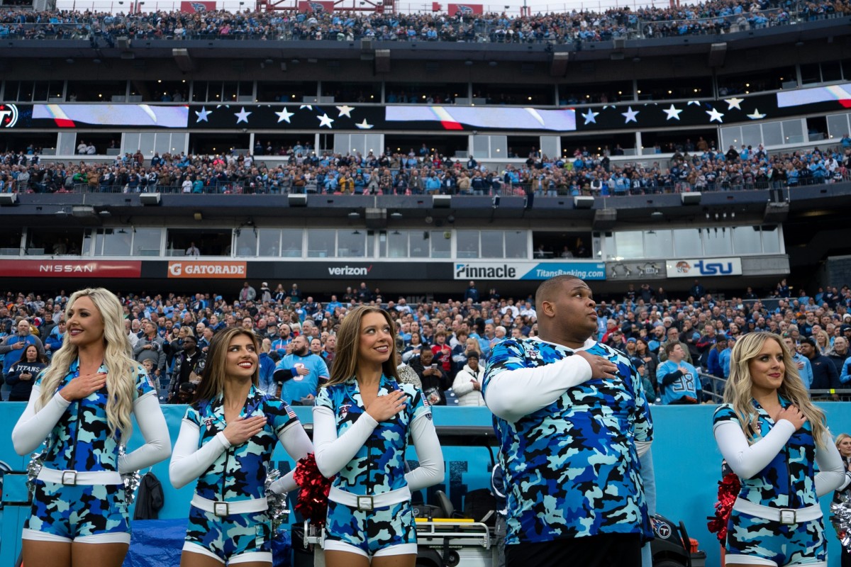 Tennessee Titans cheerleaders take part in The National Anthem before the game against the Carolina Panthers at Nissan Stadium.