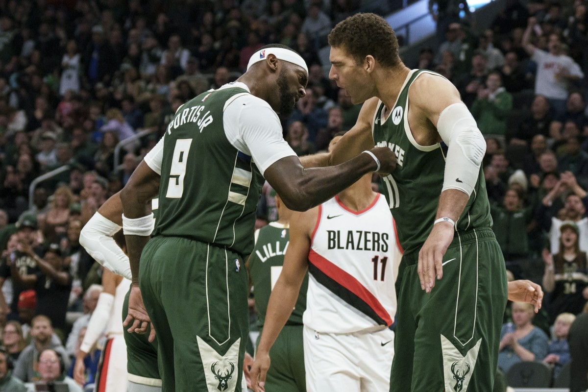 Milwaukee Bucks forward Bobby Portis (9) celebrates with center Brook Lopez (11) after scoring a basket