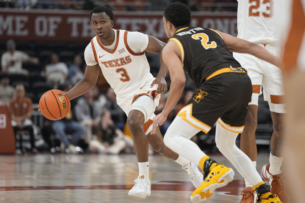 Texas Longhorns guard Max Abmas (3) looks to pass the ball during the first half against the Wyoming Cowboys at Moody Center.