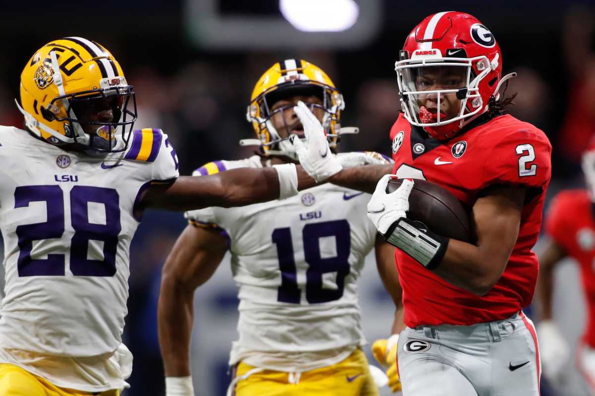 Georgia running back Kendall Milton (2) moves the ball past LSU safety Major Burns (28) during the second half of the SEC Championship NCAA college football game between LSU and Georgia in Atlanta, on Saturday, Dec. 3, 2022. Georgia won 50-30. (Joshua L Jones / USA TODAY NETWORK).