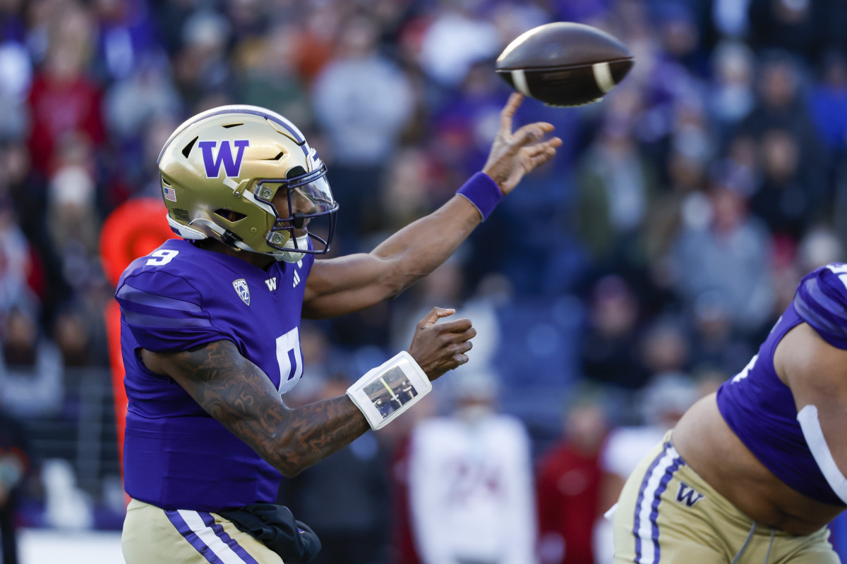 Washington Huskies quarterback Michael Penix Jr. throws a pass against the Washington State Cougars.