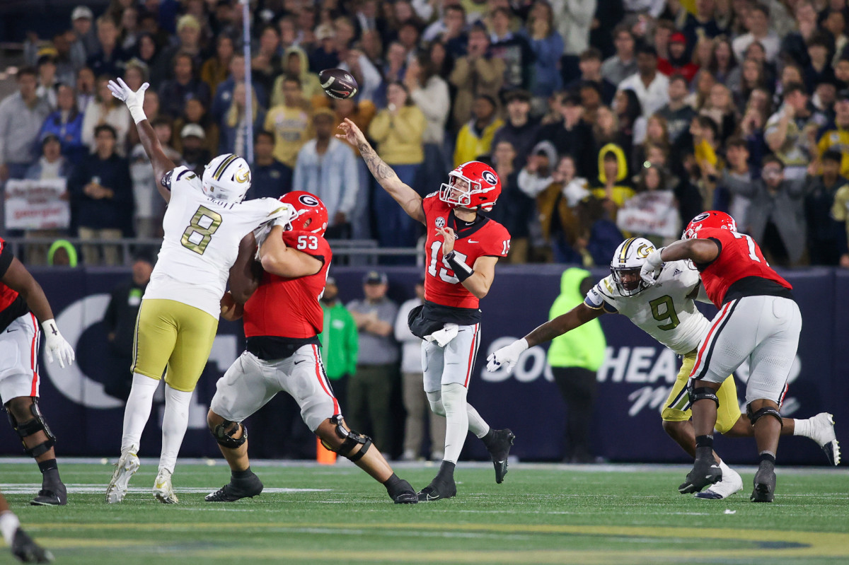 Georgia Bulldogs quarterback Carson Beck throws a pass against the Georgia Tech Yellow Jackets.