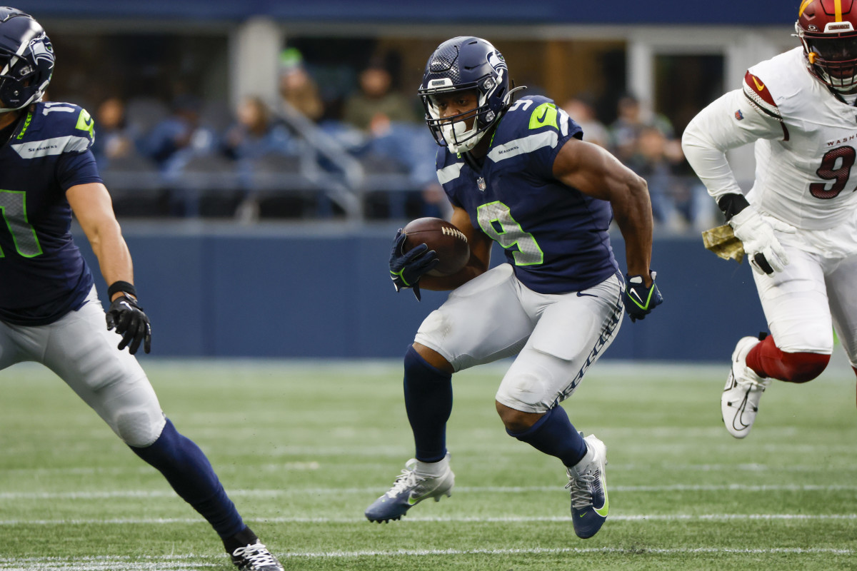 Seattle Seahawks running back Kenneth Walker III (9) rushes against the Washington Commanders during the second quarter at Lumen Field.