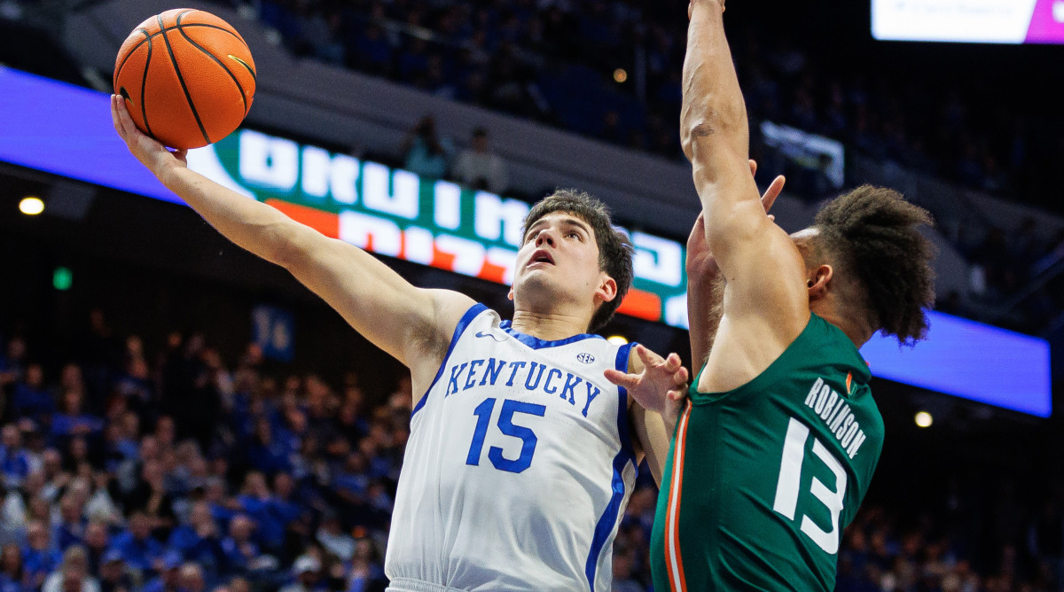 Kentucky Wildcats guard Reed Sheppard goes to the basket against Miami (Fl) Hurricanes guard Jakai Robinson during the ACC/SEC Challenge.