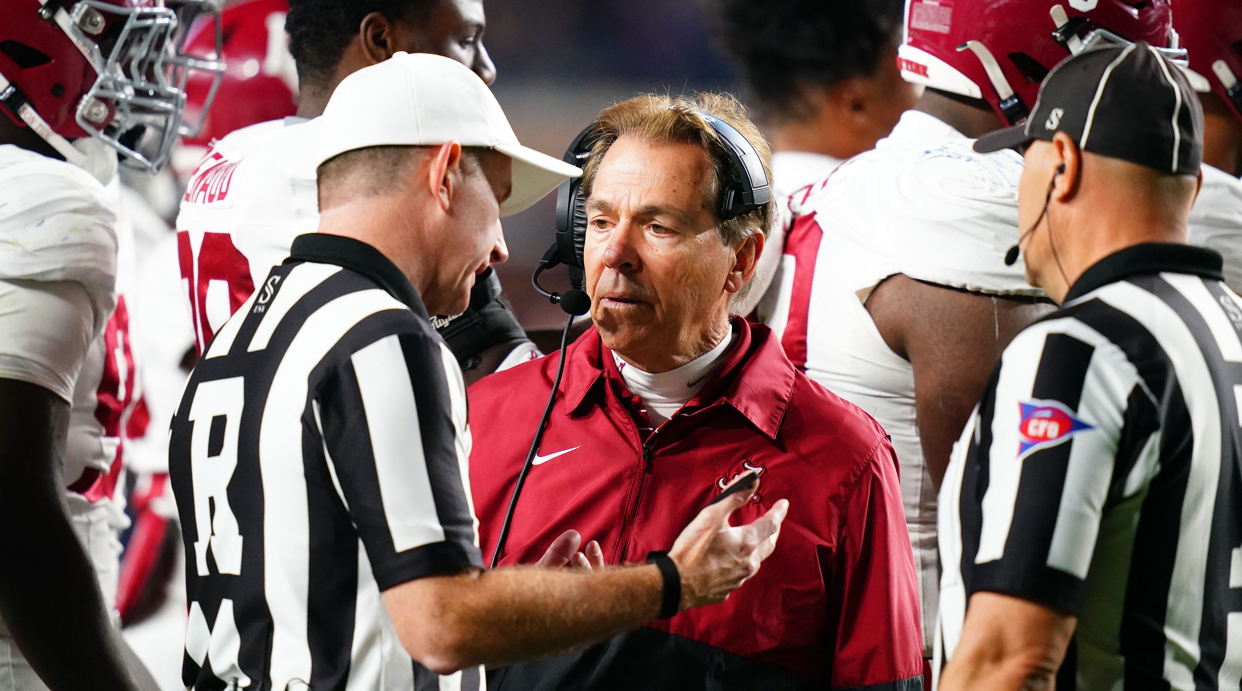 Alabama coach Nick Saban discusses a call with officials.