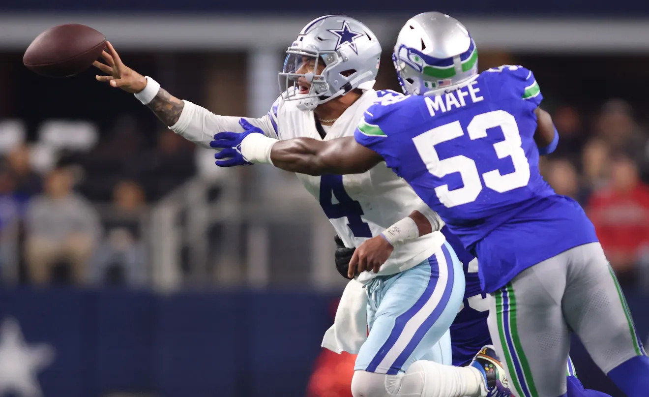 Dallas Cowboys quarterback Dak Prescott gets a pass off in the face of pressure.