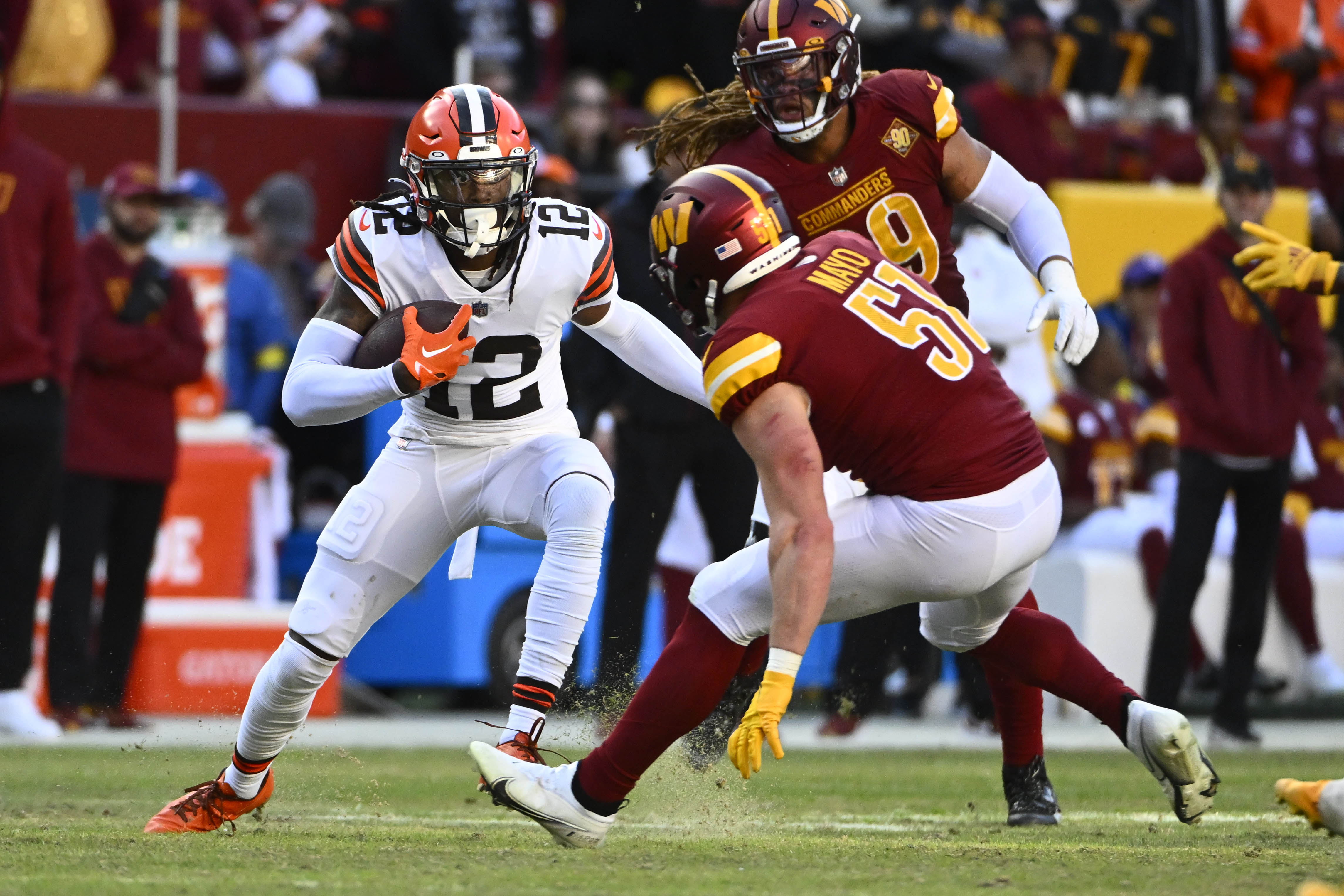 Jan 1, 2023; Landover, Maryland, USA; Cleveland Browns wide receiver Michael Woods II (12) runs after a catch as Washington Commanders linebacker David Mayo (51) defends during the second half at FedExField.