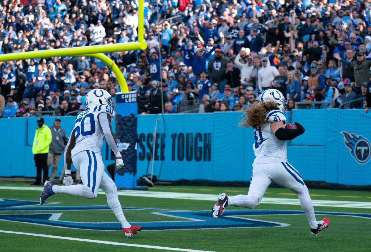 Indianapolis Colts linebacker Grant Stuard (41) runs in a touchdown against the Tennessee Titans in the fourth quarter after recovering a blocked Titans punt during their game at Nissan Stadium in Nashville, Tenn., Sunday, Dec. 3, 2023.  