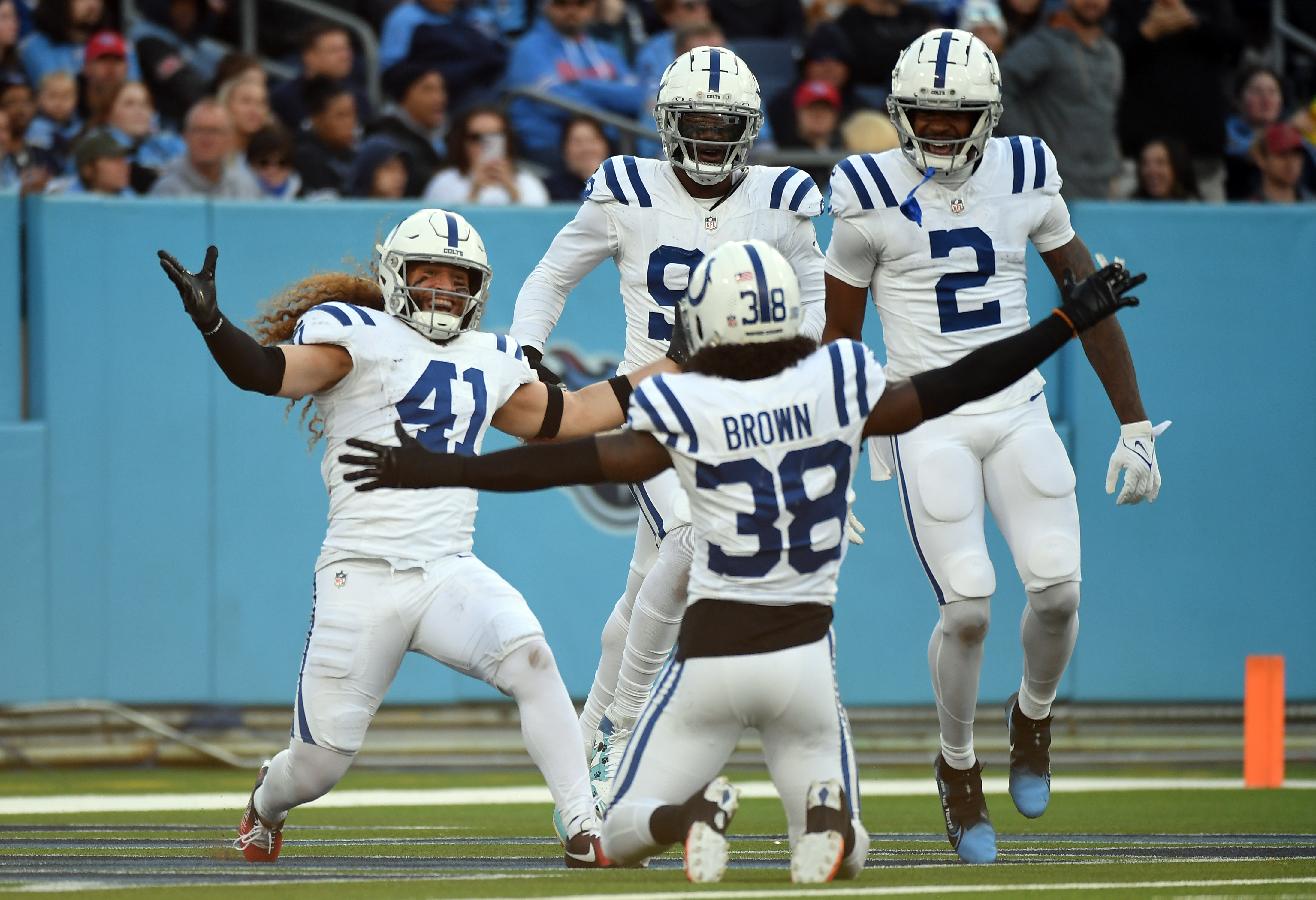 Dec 3, 2023; Nashville, Tennessee, USA; Indianapolis Colts linebacker Grant Stuard (41) and cornerback Tony Brown (38)celebrate after returning a blocked punt for a touchdown during the second half against the Tennessee Titans at Nissan Stadium.