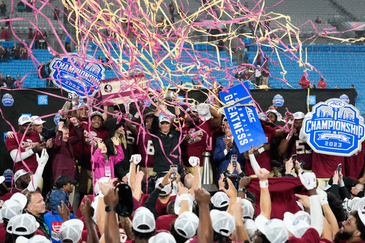 Florida State Seminoles head coach Mike Norvell celebrates winning the ACC Championship with his players after the game against the Louisville Cardinals at Bank of America Stadium.