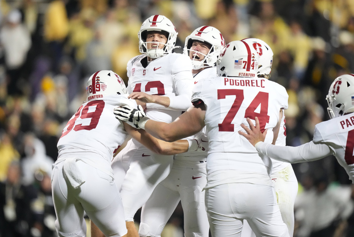 Oct 13, 2023; Boulder, Colorado, USA; Stanford Cardinal place kicker Joshua Karty (43) (center) and (15) punter Connor Weselman (15) and tight end Lukas Ungar (89) and Stanford Cardinal offensive lineman James Pogorelc (74) celebrates defeating the Colorado Buffaloes in double overtime at Folsom Field. Mandatory Credit: Ron Chenoy-USA TODAY Sports