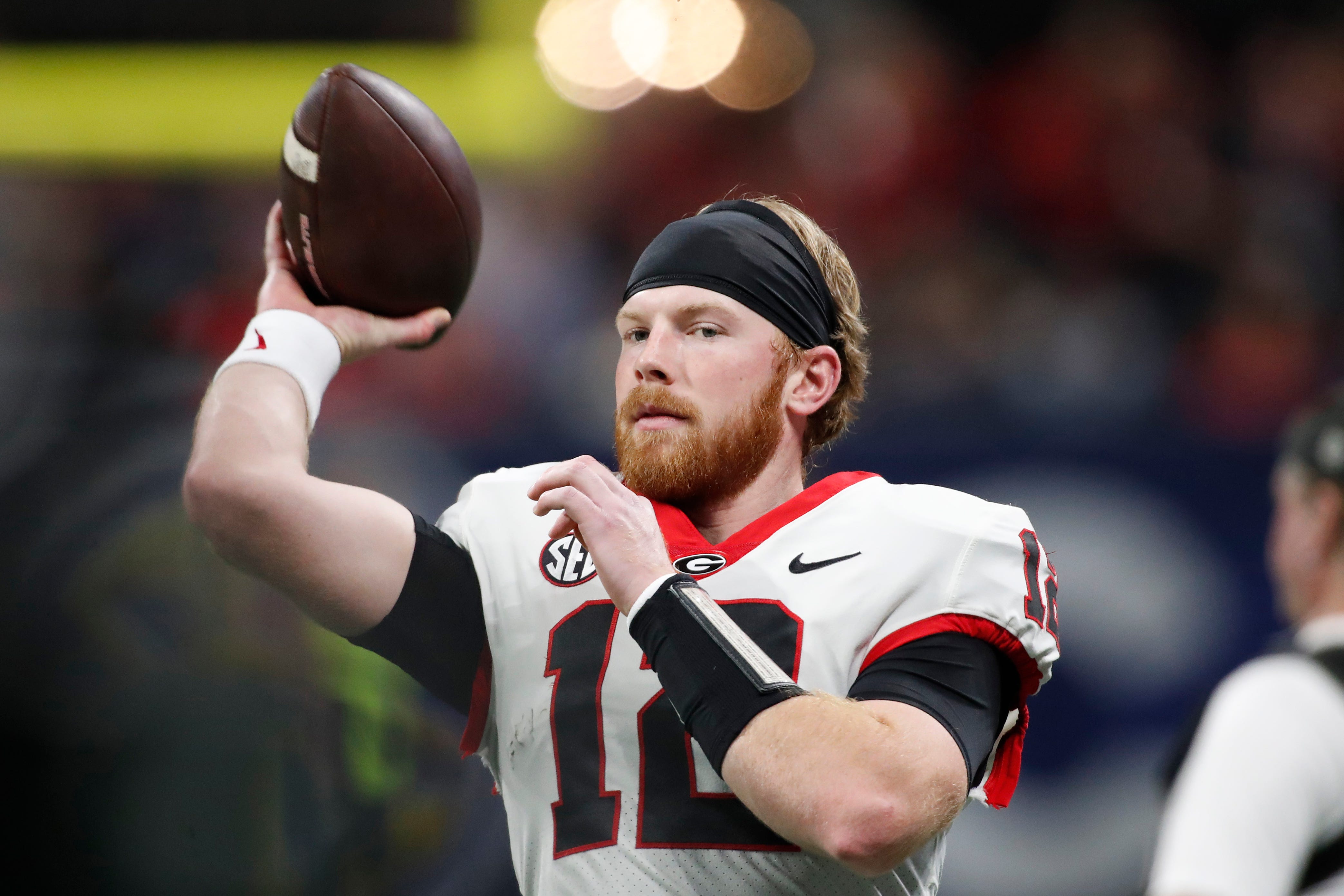 Georgia quarterback Brock Vandagriff (12) warms up before the start of the SEC Championship game against Alabama at Mercedes-Benz Stadium in Atlanta, on Saturday, Dec. 2, 2023.