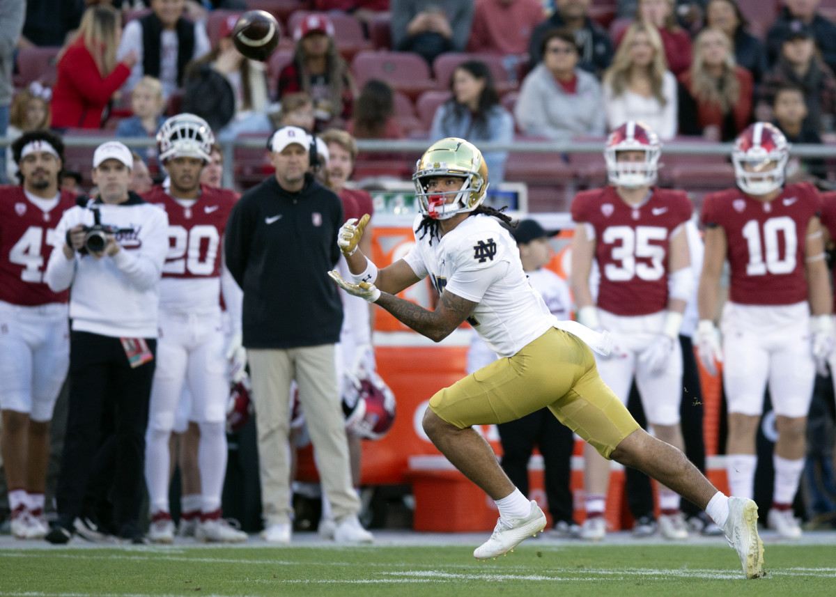 Nov 25, 2023; Stanford, California, USA; Notre Dame Fighting Irish wide receiver Rico Flores Jr. (17) hauls in a pass from quarterback Sam Hartman during the first quarter at Stanford Stadium. Mandatory Credit: D. Ross Cameron-USA TODAY Sports