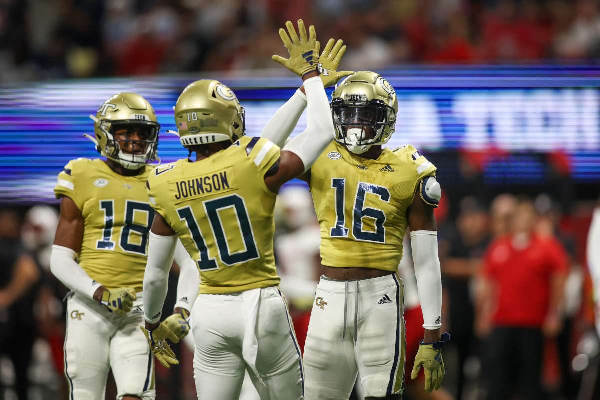 Sep 1, 2023; Atlanta, Georgia, USA; Georgia Tech Yellow Jackets defensive back K.J. Wallace (16) reacts after a pass breakup with defensive back Kenan Johnson (10) against the Louisville Cardinals in the first quarter at Mercedes-Benz Stadium. Mandatory Credit: Brett Davis-USA TODAY Sports