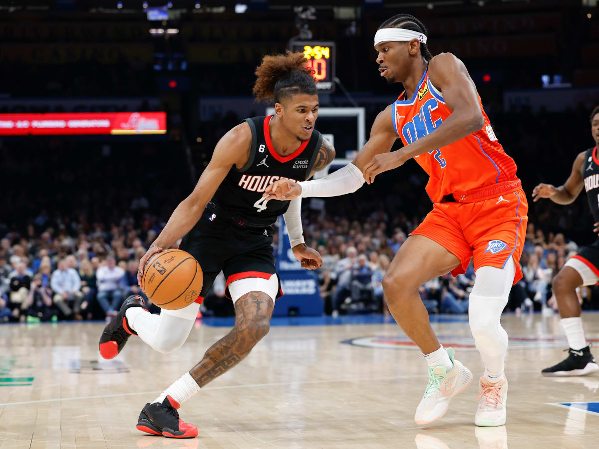 Shai Gilgeous-Alexander defends a drive by Houston Rockets guard Jalen Green during the second quarter at Paycom Center.