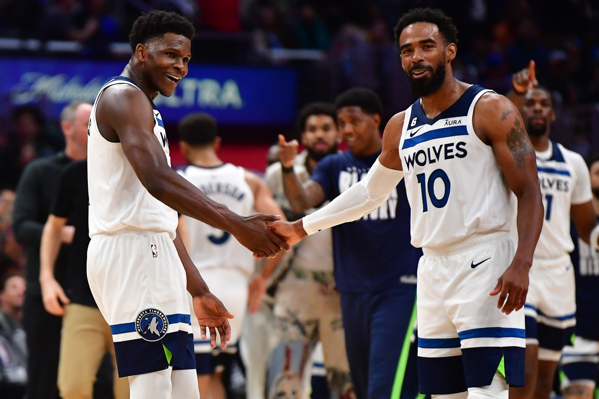 Feb 28, 2023; Los Angeles, California, USA; Minnesota Timberwolves guard Anthony Edwards (1) and guard Mike Conley (10) react against the Los Angeles Clippers during the second half at Crypto.com Arena.