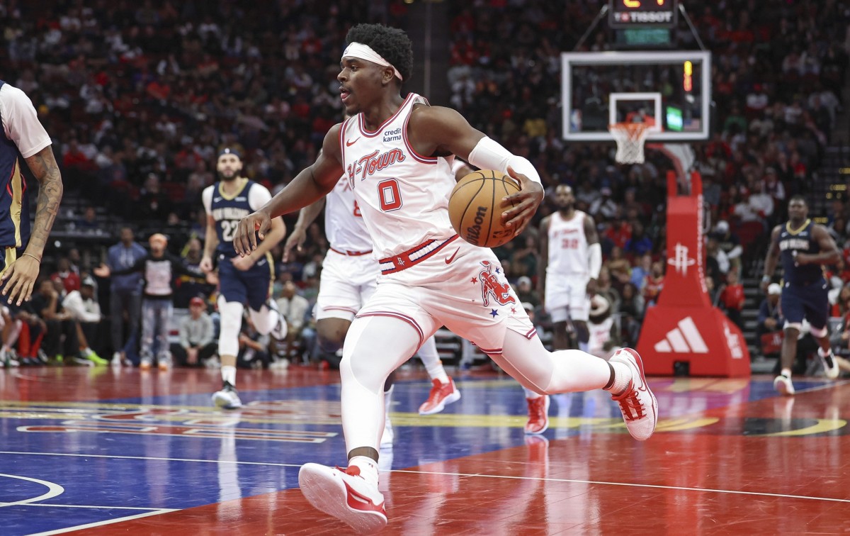 Houston Rockets guard Aaron Holiday (0) drives with the ball during the third quarter against the New Orleans Pelicans 