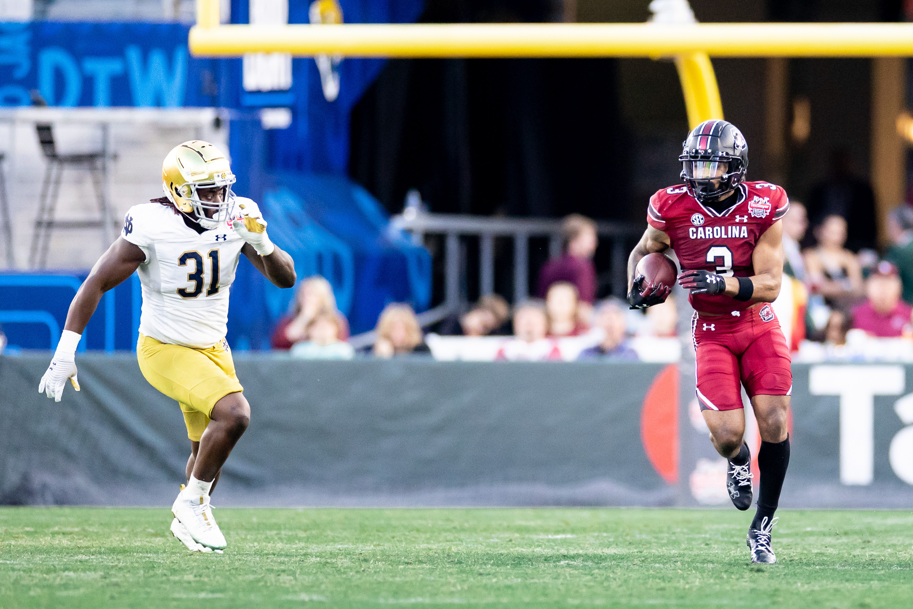 Dec 30, 2022; Jacksonville, FL, USA; Notre Dame Fighting Irish defensive lineman Nana Osafo-Mensah (31) chases South Carolina Gamecocks wide receiver Antwane Wells Jr. (3) during the first half in the 2022 Gator Bowl at TIAA Bank Field. Mandatory Credit: Matt Pendleton-USA TODAY Sports