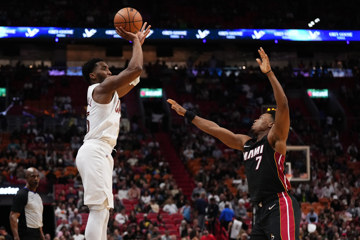 Dec 8, 2023; Miami, Florida, USA; Cleveland Cavaliers guard Donovan Mitchell (45) shoots over Miami Heat guard Kyle Lowry (7) during the second half at Kaseya Center.