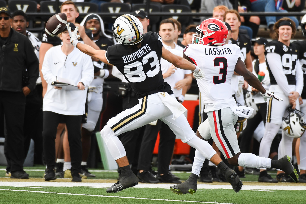 Oct 14, 2023; Nashville, Tennessee, USA; Vanderbilt Commodores wide receiver London Humphreys (83) misses a reception as he is defended by Georgia Bulldogs defensive back Kamari Lassiter (3) during the second half at FirstBank Stadium. © Christopher Hanewinckel-USA TODAY Sports