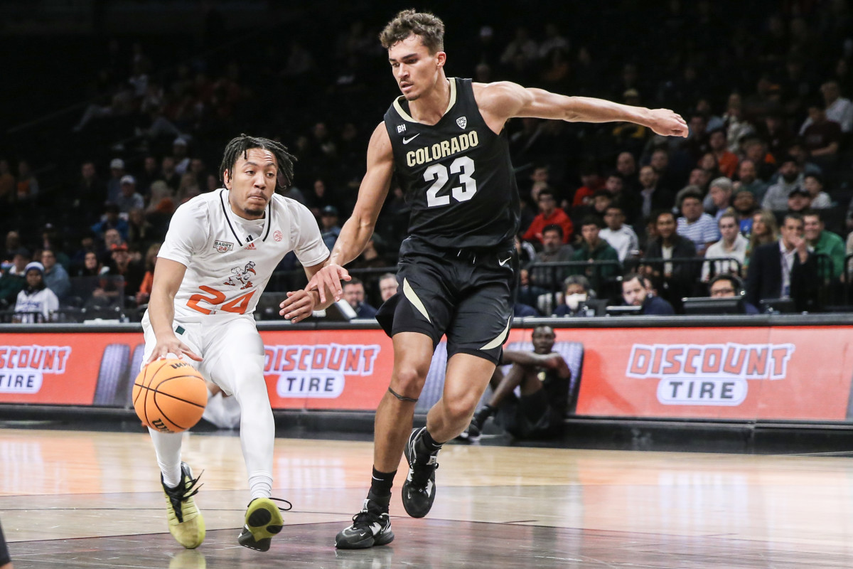 Dec 10, 2023; Brooklyn, New York, USA; Miami (Fl) Hurricanes guard Nijel Pack (24) looks to drive past Colorado Buffaloes forward Tristan da Silva (23) in the first half at Barclays Center