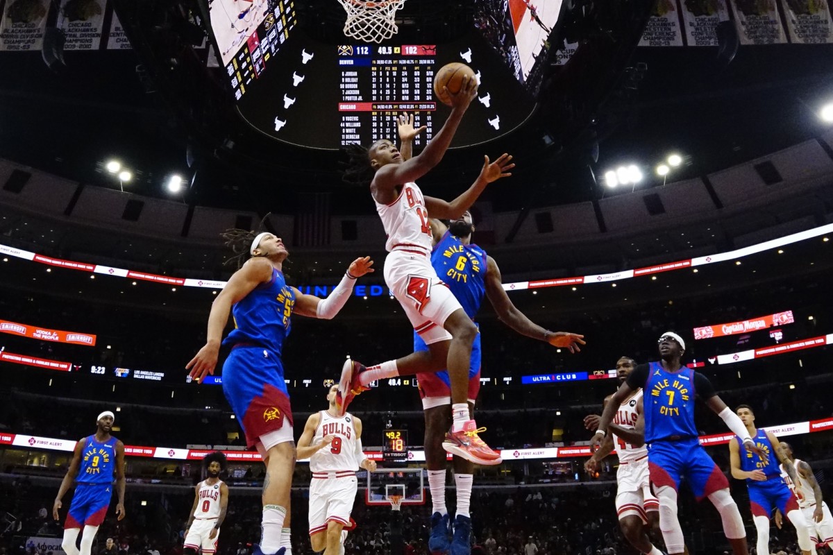 Denver Nuggets center DeAndre Jordan (6) defends Chicago Bulls guard Ayo Dosunmu (12) during the second half at United Center.