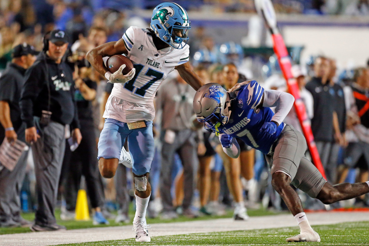 Oct 13, 2023; Memphis, Tennessee, USA; Tulane Green Wave wide receiver Chris Brazzell II (17) runs after a catch as Memphis Tigers defensive back Malik Feaster (7) knocks him out of bounds during the first half at Simmons Bank Liberty Stadium. Mandatory Credit: Petre Thomas-USA TODAY Sports