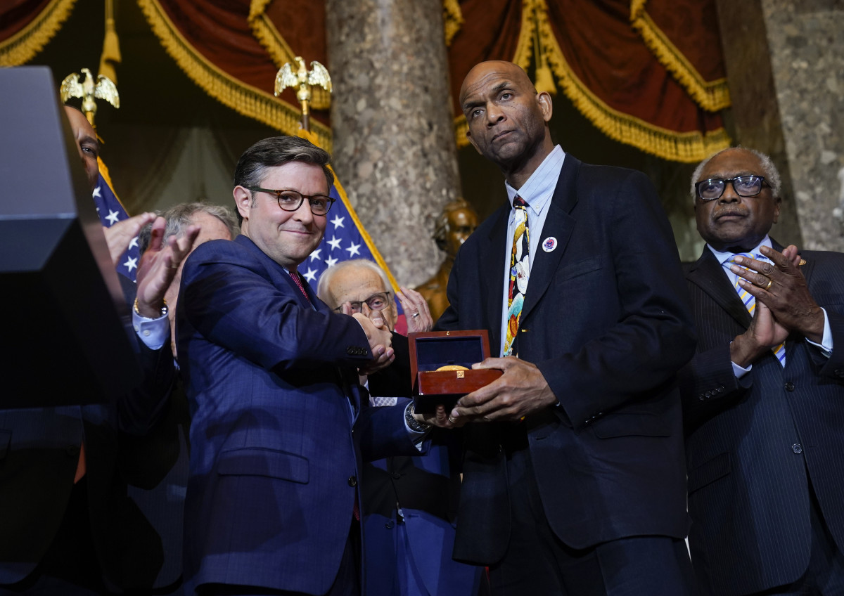 Dec. 13, 2023; Washington, D.C., USA - Speaker of the House Mike Johnson (R-LA), center left, presents Larry Doby Jr. the son of Larry Doby, a pioneering force for Black baseball players and a native of Paterson, N.J., the Congressional Gold Medal during a ceremony at the U.S. Capitol in Washington, D.C.