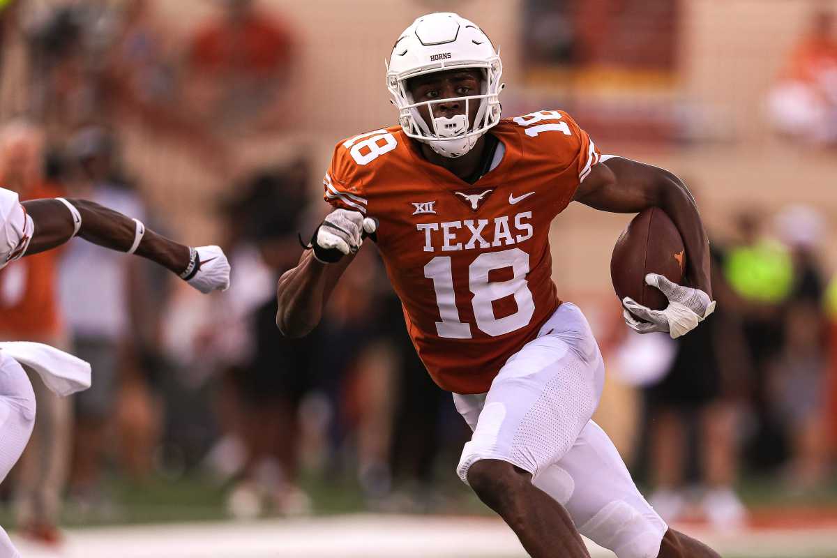 Texas wide receiver Isaiah Neyor (18) runs the ball during Texas's annual spring football game at Royal Memorial Stadium in Austin, Texas on April 23, 2022. Neyor