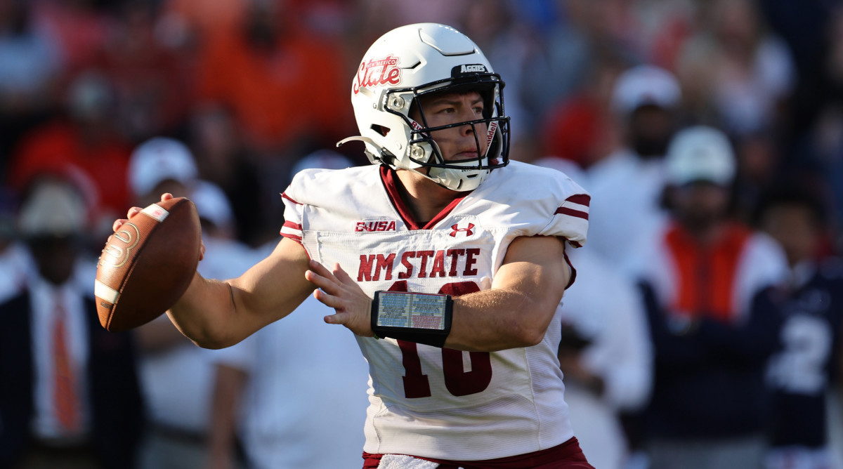 New Mexico State quarterback Diego Pavia drops back to pass