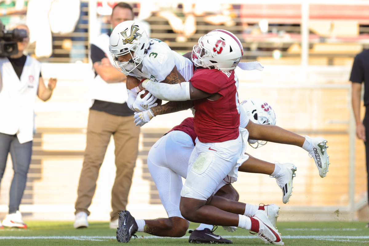 Sep 16, 2023; Stanford, California, USA; Sacramento State Hornets wide receiver Chris Miller (3) is tackled by Stanford Cardinal linebacker Gaethan Bernadel (0) during the second quarter at Stanford Stadium. Mandatory Credit: Sergio Estrada-USA TODAY Sports