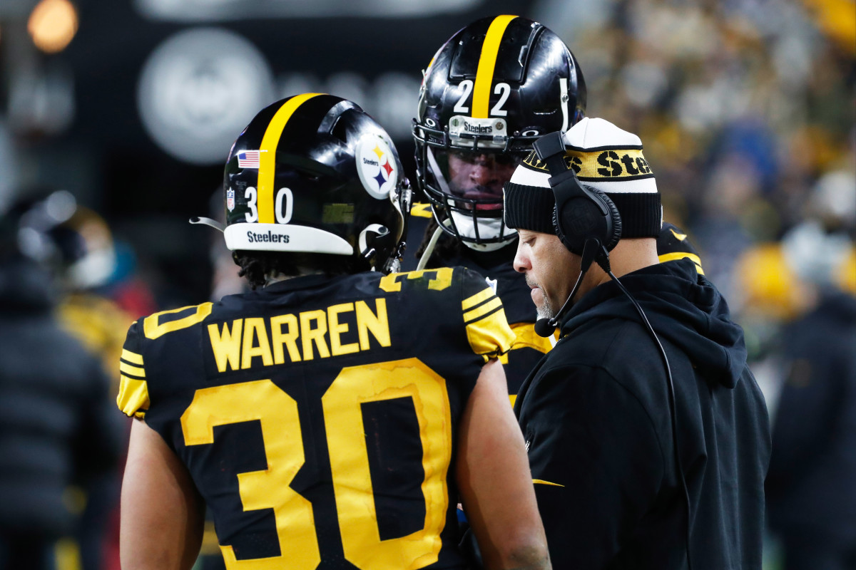 Dec 7, 2023; Pittsburgh, Pennsylvania, USA; Pittsburgh Steelers running backs Jaylen Warren (30) and Najee Harris (22) talk with running backs coach Eddie Faulkner (right) on the sidelines against the New England Patriots during the third quarter at Acrisure Stadium.