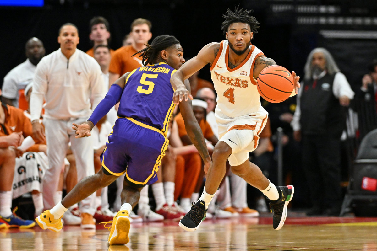 Texas Longhorns guard Tyrese Hunter (4) reaches for the ball against LSU Tigers forward Mwani Wilkinson (5) during the first half at Toyota Center.