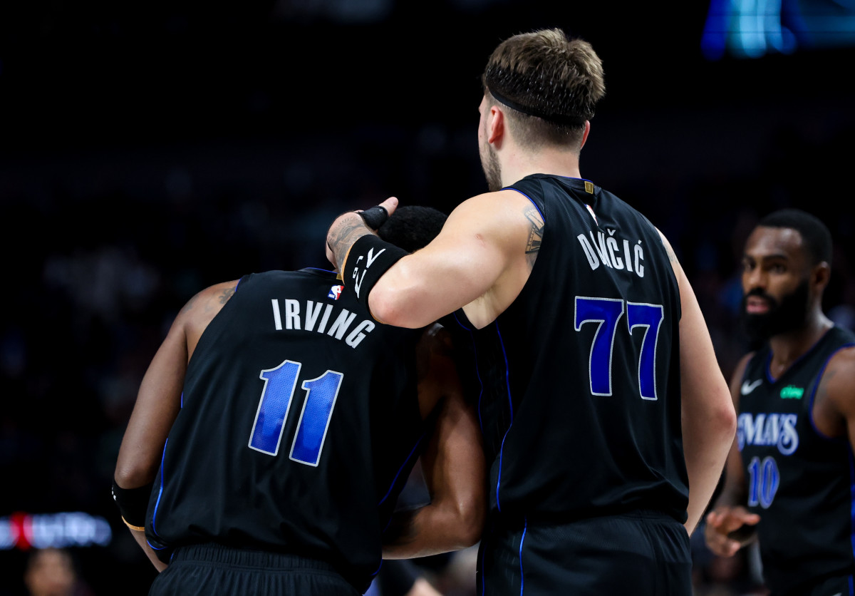 Mavs' Luka Doncic and Kyrie Irving share an embrace against the Utah Jazz.